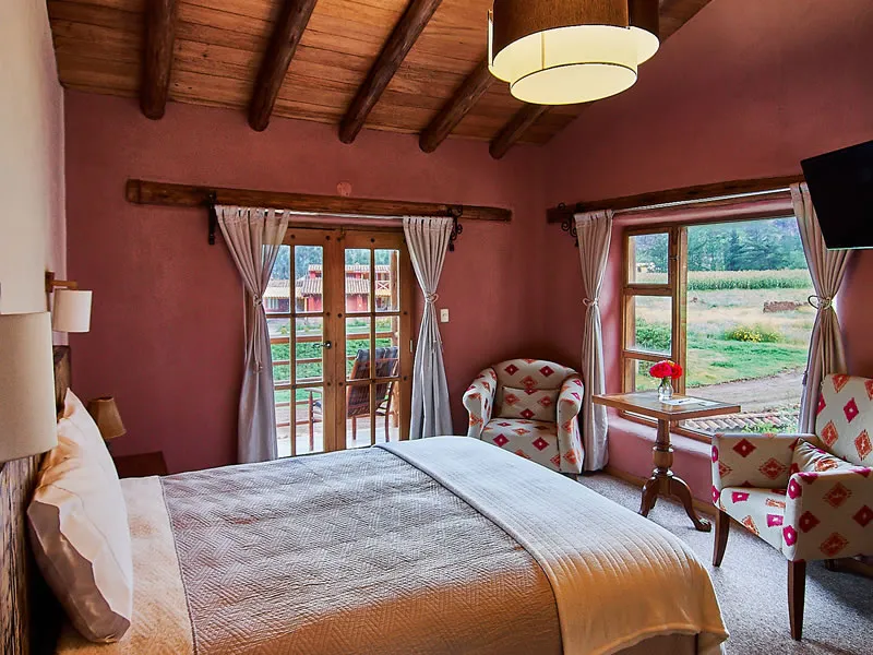 Habitación Matrimonial King de Allpawasi Lodge con cama king y vista al jardín